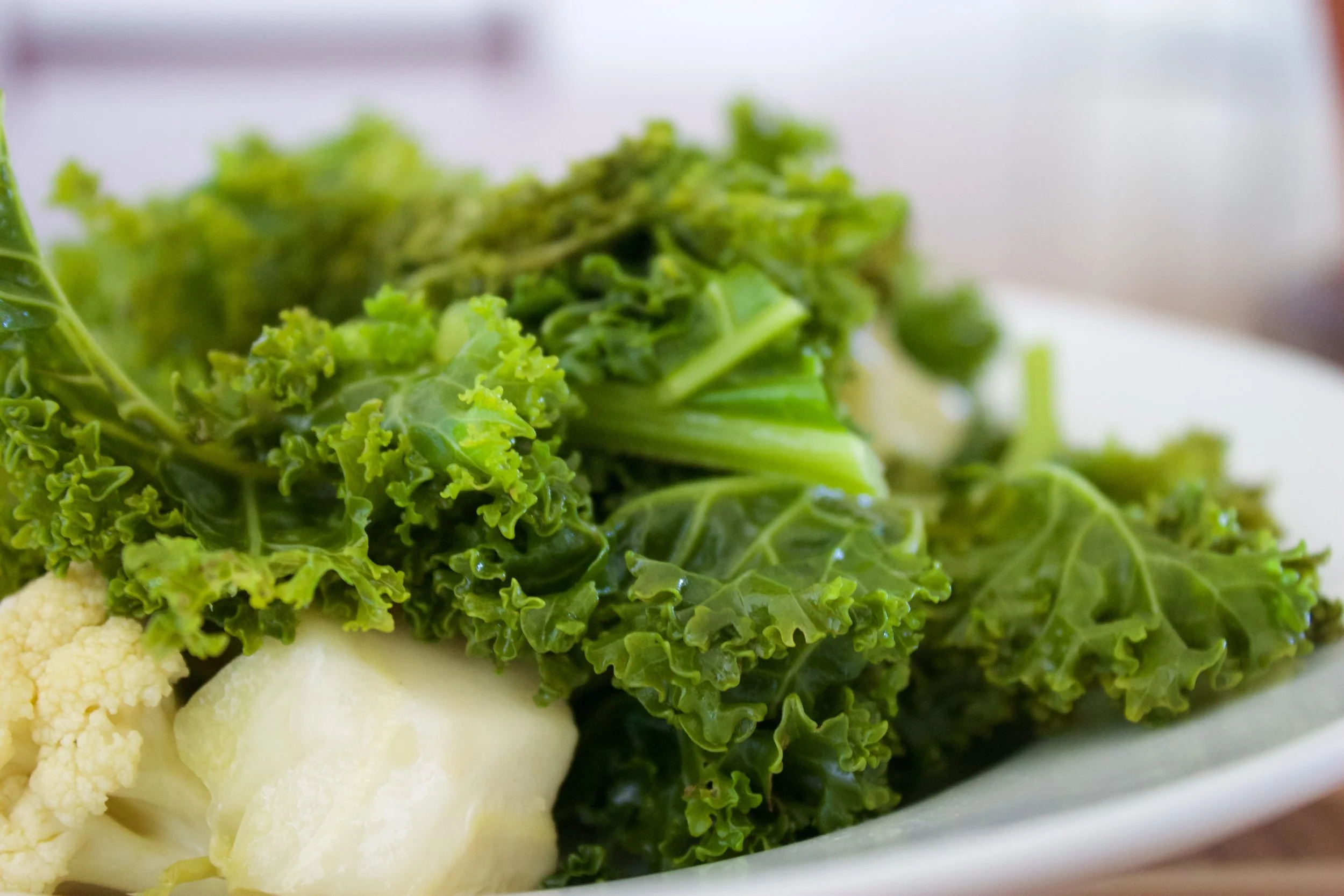 Kale is a hearty vegetable I like steaming kale with a bit of water in heavy pot. I then add them to more vegetables and some citrus dressing for taste. 