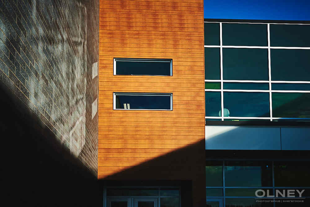 siding glass and stone on new school construction