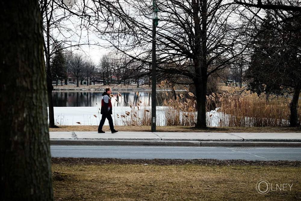 men walking by the bay