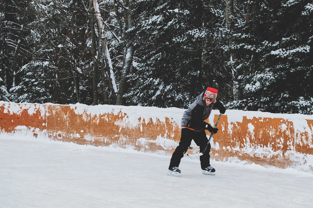 Young man playing hockey outside