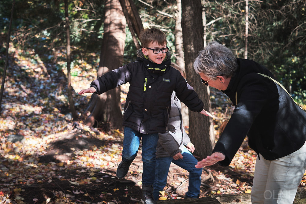 young boy playing with grandmother