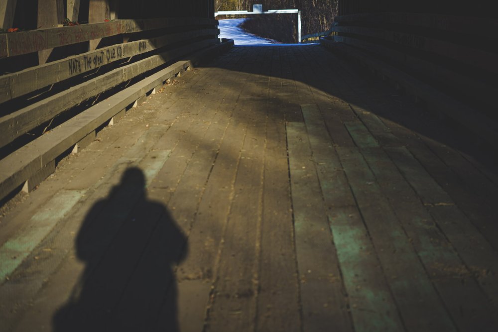 Inside the covered bridge, photographer's silhouette