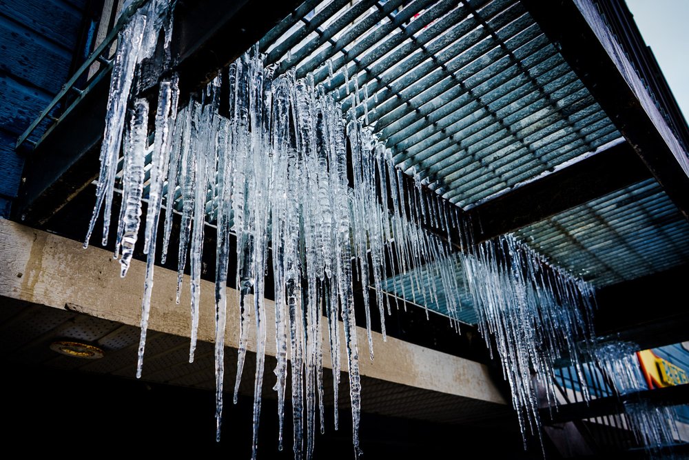 icicles under metal staircase, in North Hatley, QC, Canada