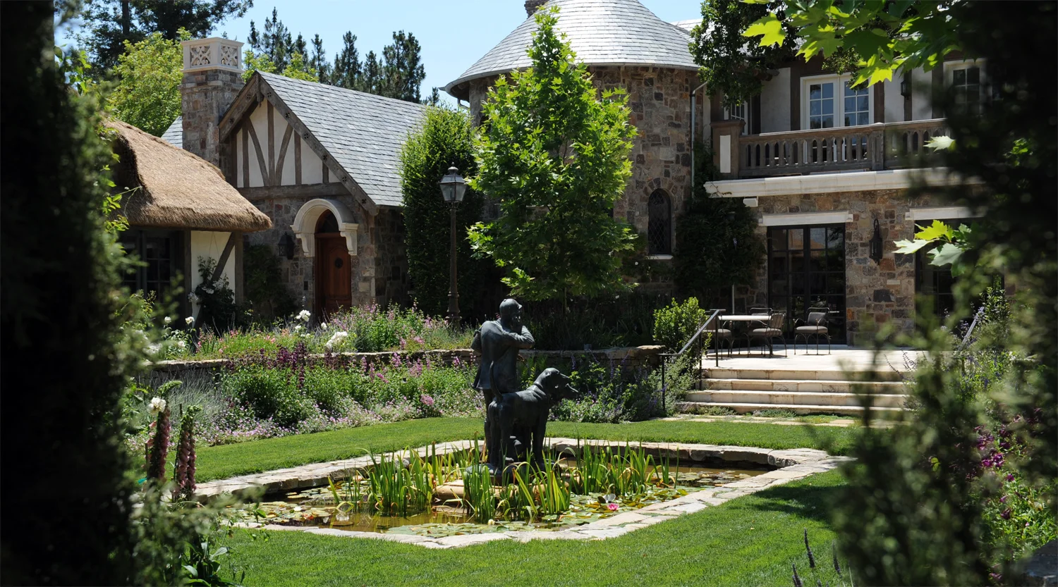 Inspired by English and French farmhouse gardens, old-world stone paths and walls winding through intimate garden rooms, expansive park like lawns and picturesque pond courtyard. Design and installation.