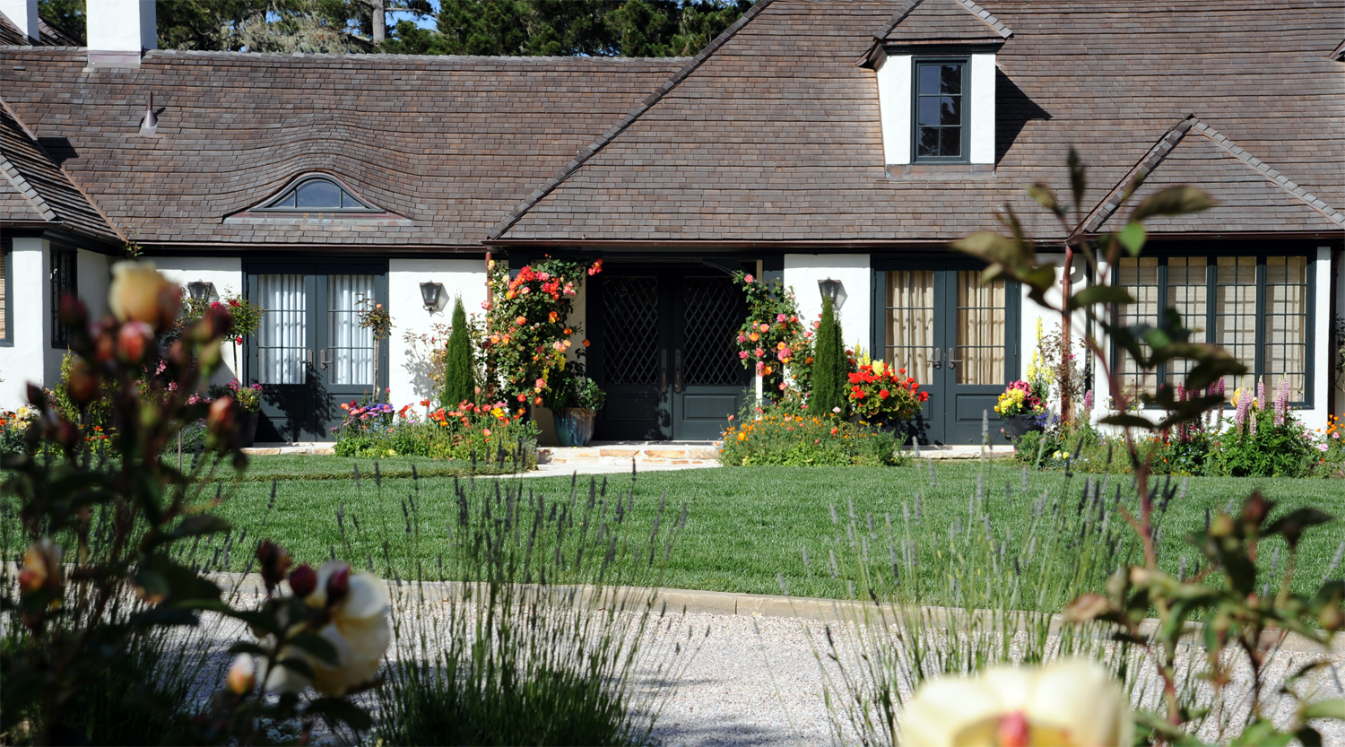 Inspired by the Provence region of France; this residence is set on the uphill end of a valley overlooking their vineyard and country barn below. Estate Garden - Design and Installation