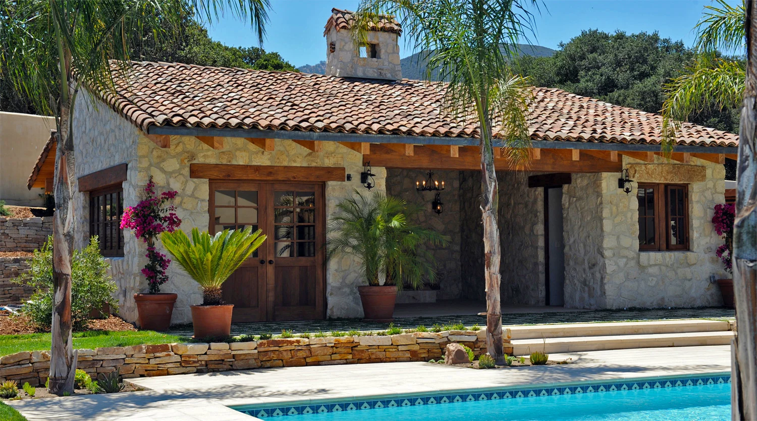 Inspired by centuries old Tuscan farmhouses in Italy. Pool Pavilion, Swimming Pool, and surrounding landscaping. Building Design & Construction, Landscaping Design & Installation.