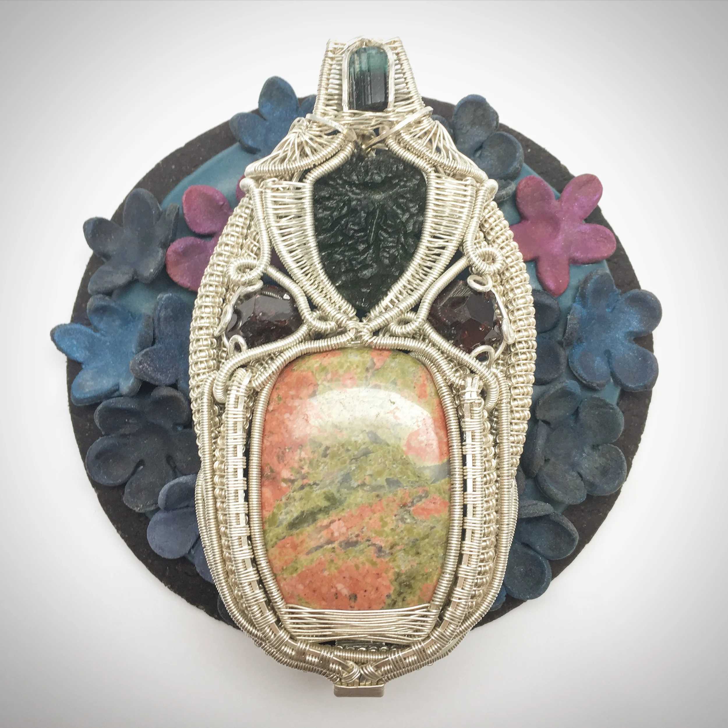 Unakite, Moldavite, Blue Tourmaline, and Iranian Hessonite Garnet Pendant Wrapped in Sterling Silver