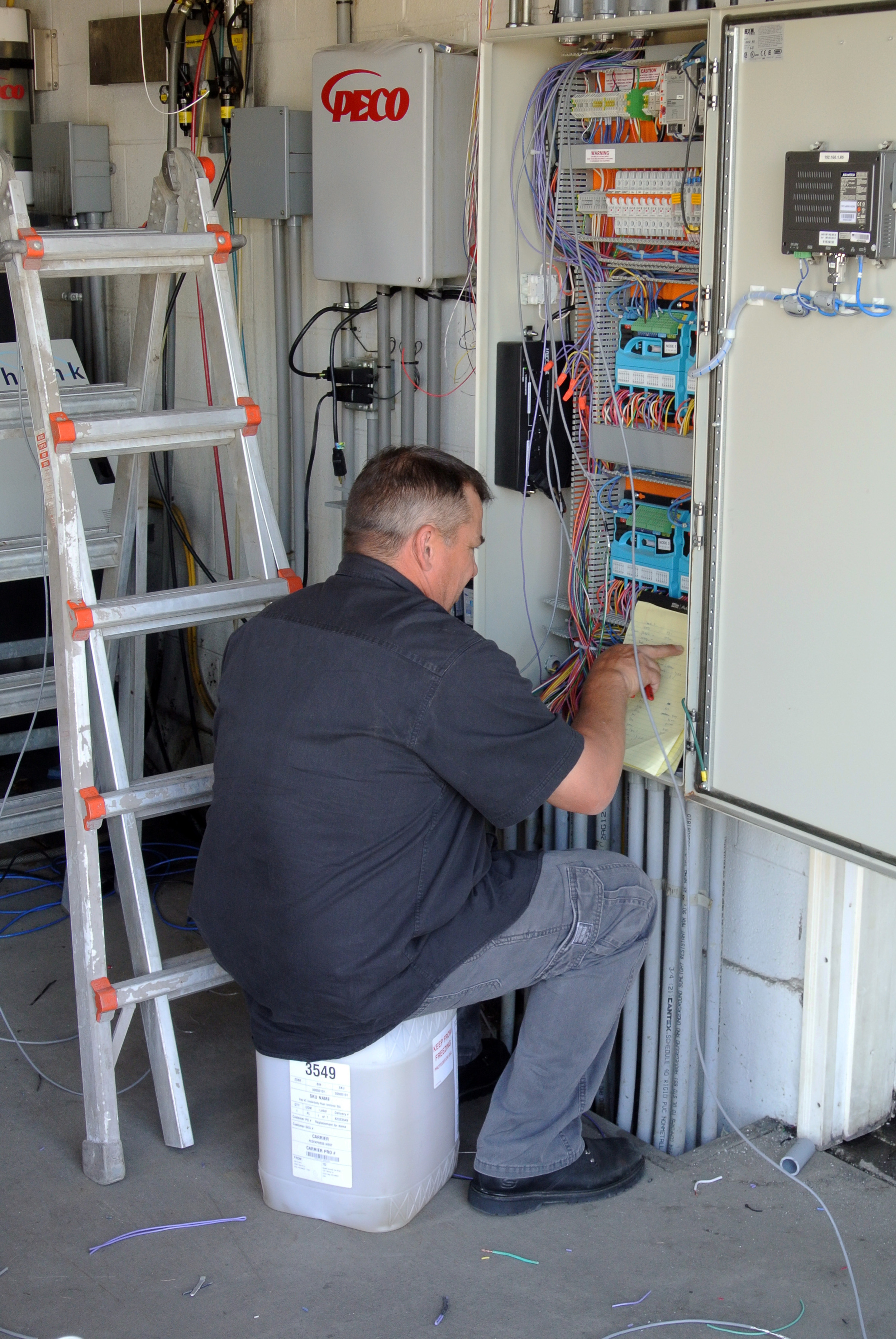 Mike Jensen custom wires a Washlink gate controller to Splash's RTC and Unitec Pay Stations.