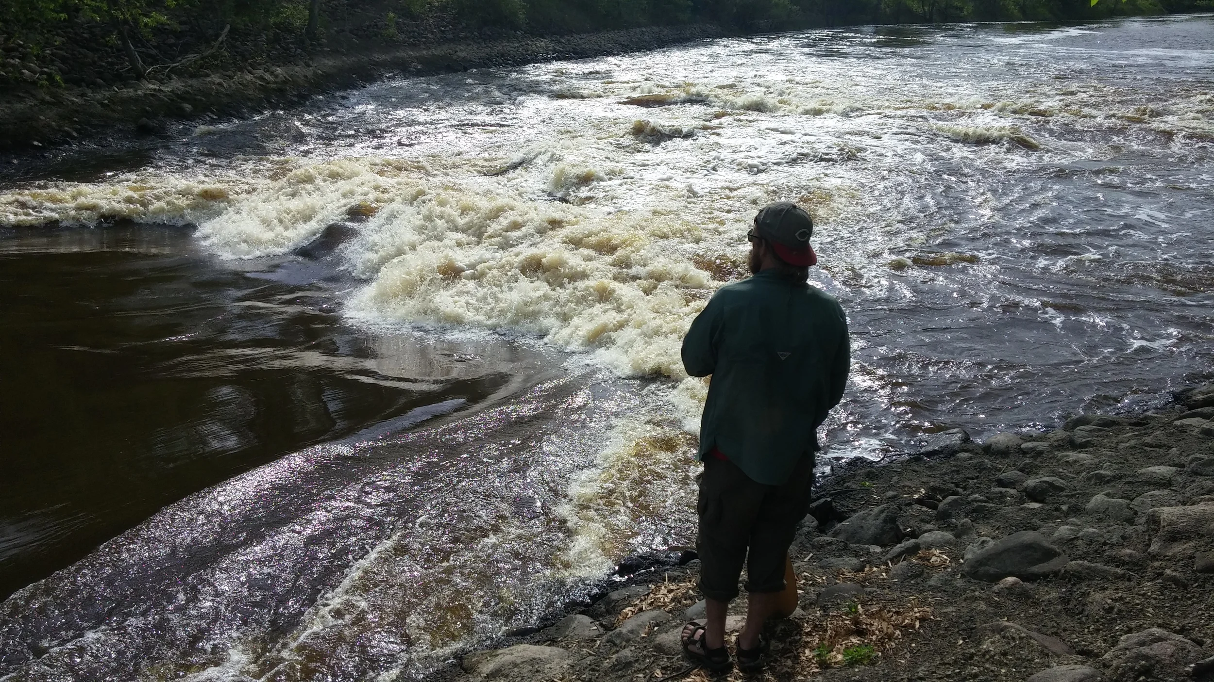 Shea surveys a treacherous stretch of river.
