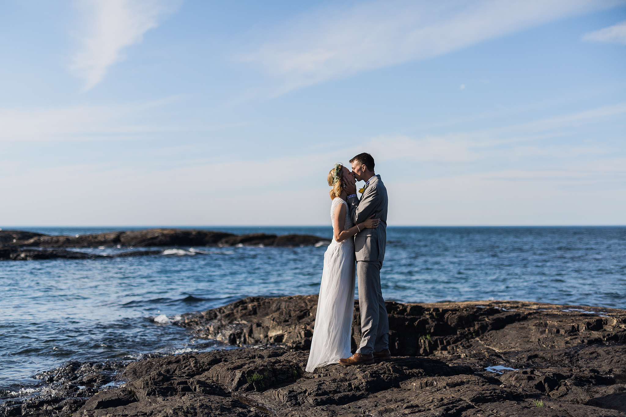 rockhill-studio-marquette-michigan-bride-groom-kissing-blackrocks-presque-isle.jpg