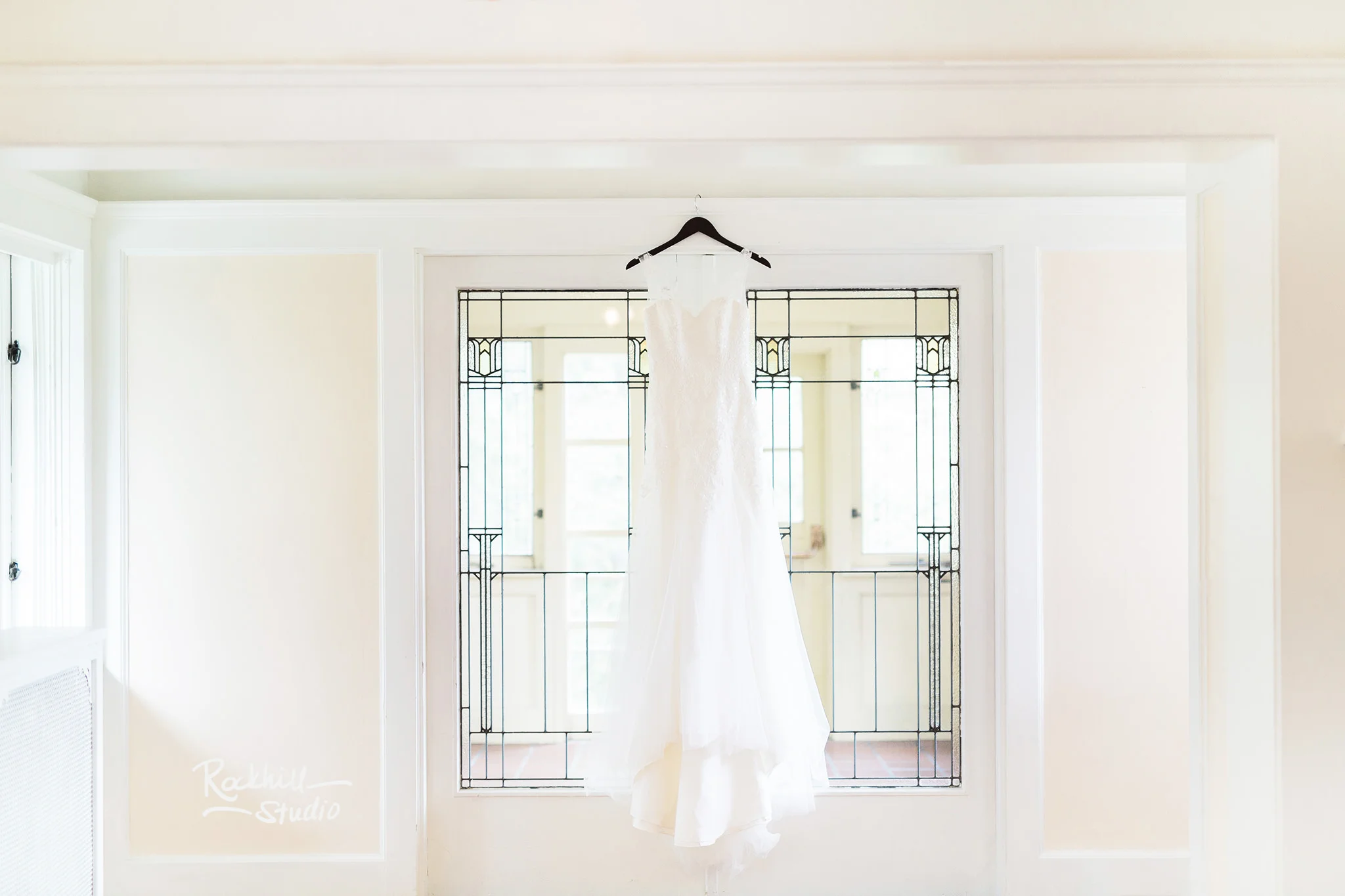 Traverse City Wedding Photographer, brides wedding dress hanging, Rockhill Studio, destination wedding photography
