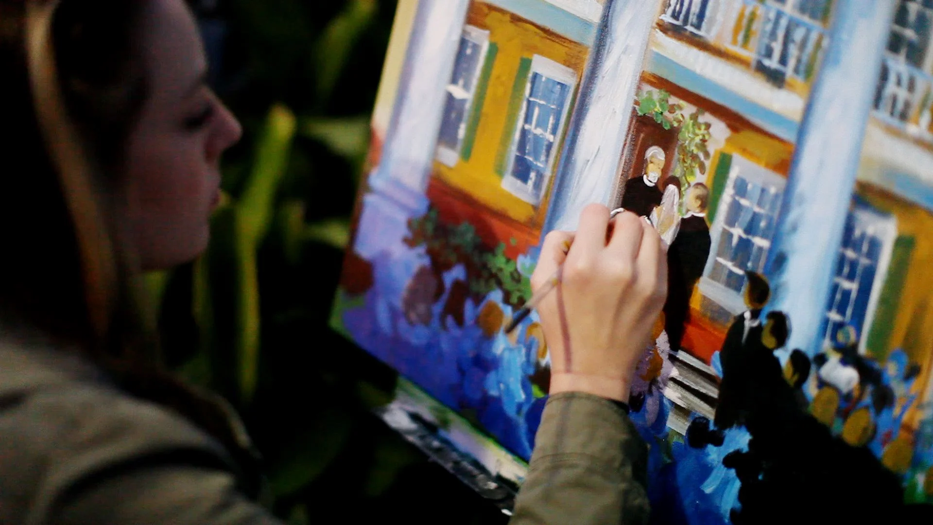 Kelly Boyett with an amazing, colorful live painting of their sunset vows.