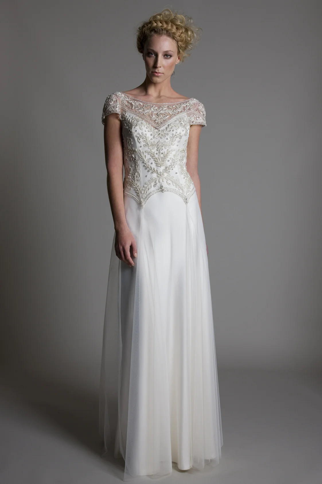 Marianne embellished beaded detailed cap sleeved bodice with tulle skirt on top of a V neck ivory satin slip bridal wedding dress by Halfpenny London