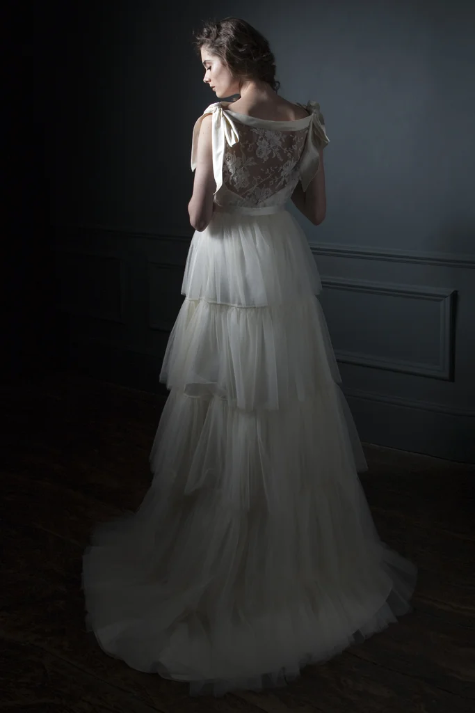 Back view of the Irene French Lace Tee and silk bow shoulder details paired with the Rita silk tulle frill skirt Bridal wedding dress by Halfpenny London