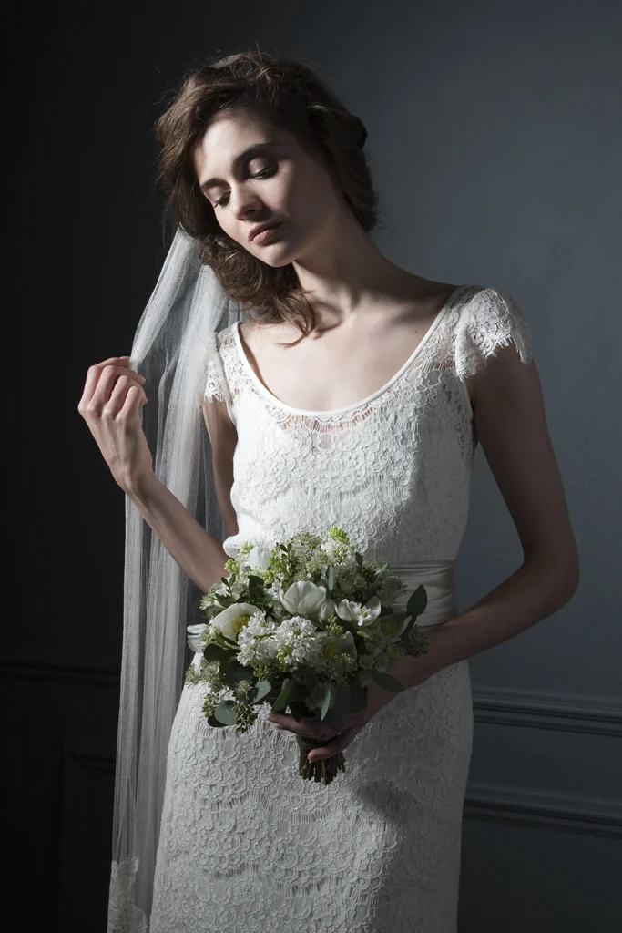 Bella Eyelash over skirt and top with satin sash over iris slip