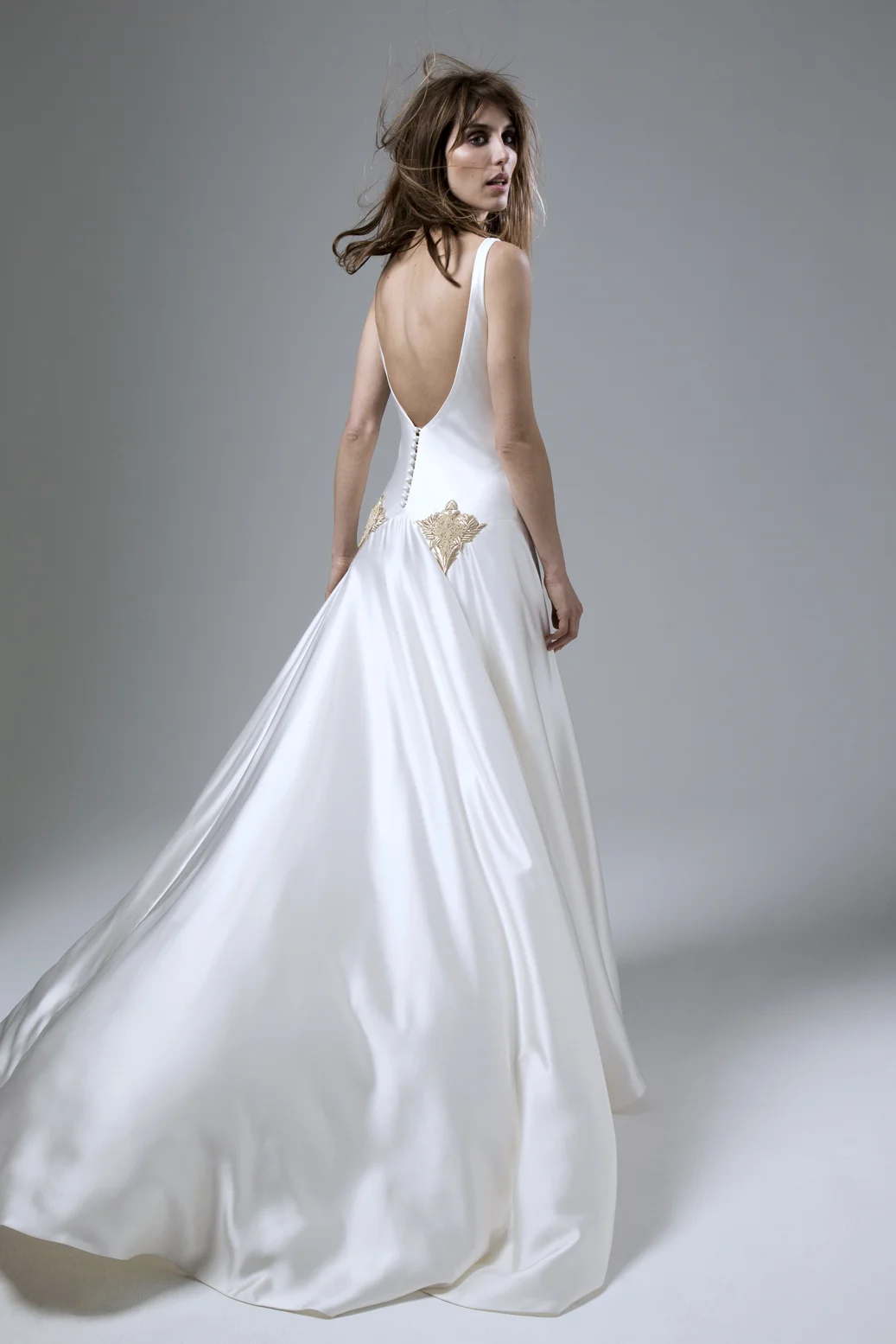 Milly Bafta V neck and low V back wedding dress with godgets and embellishment detailing designed by Halfpenny London