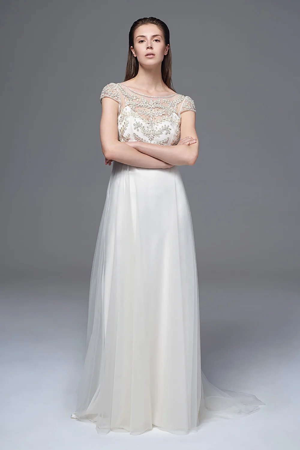 THE ELAINE DRESS WITH A HAND BEADED AND EMBROIDERED BODICE WITH A LOW V BACK WORN WITH THE CLASSIC IRIS SLIP. BRIDAL WEDDING DRESS BY HALFPENNY LONDON
