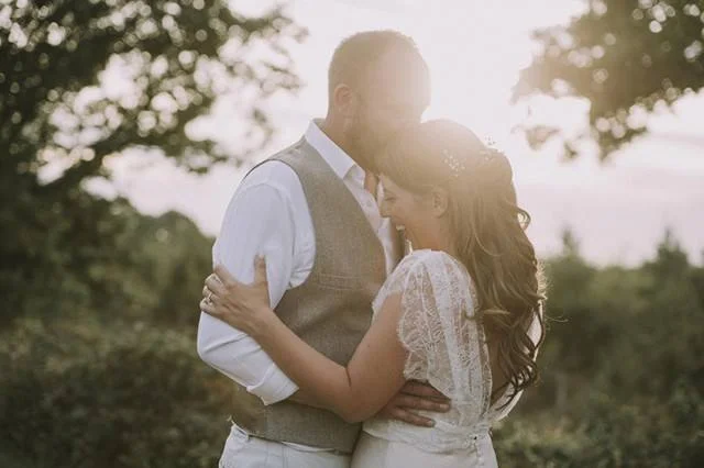 A beautiful bride wearing a Halfpenny London wedding dress