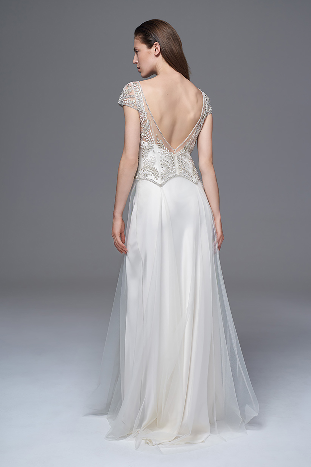THE MARIANNE HAND BEADED AND EMBROIDERED DRESS WITH A LOW V BACK AND DROP WAIST WORN WITH THE CLASSIC IRIS SLIP. BRIDAL WEDDING DRESS BY HALFPENNY LONDON