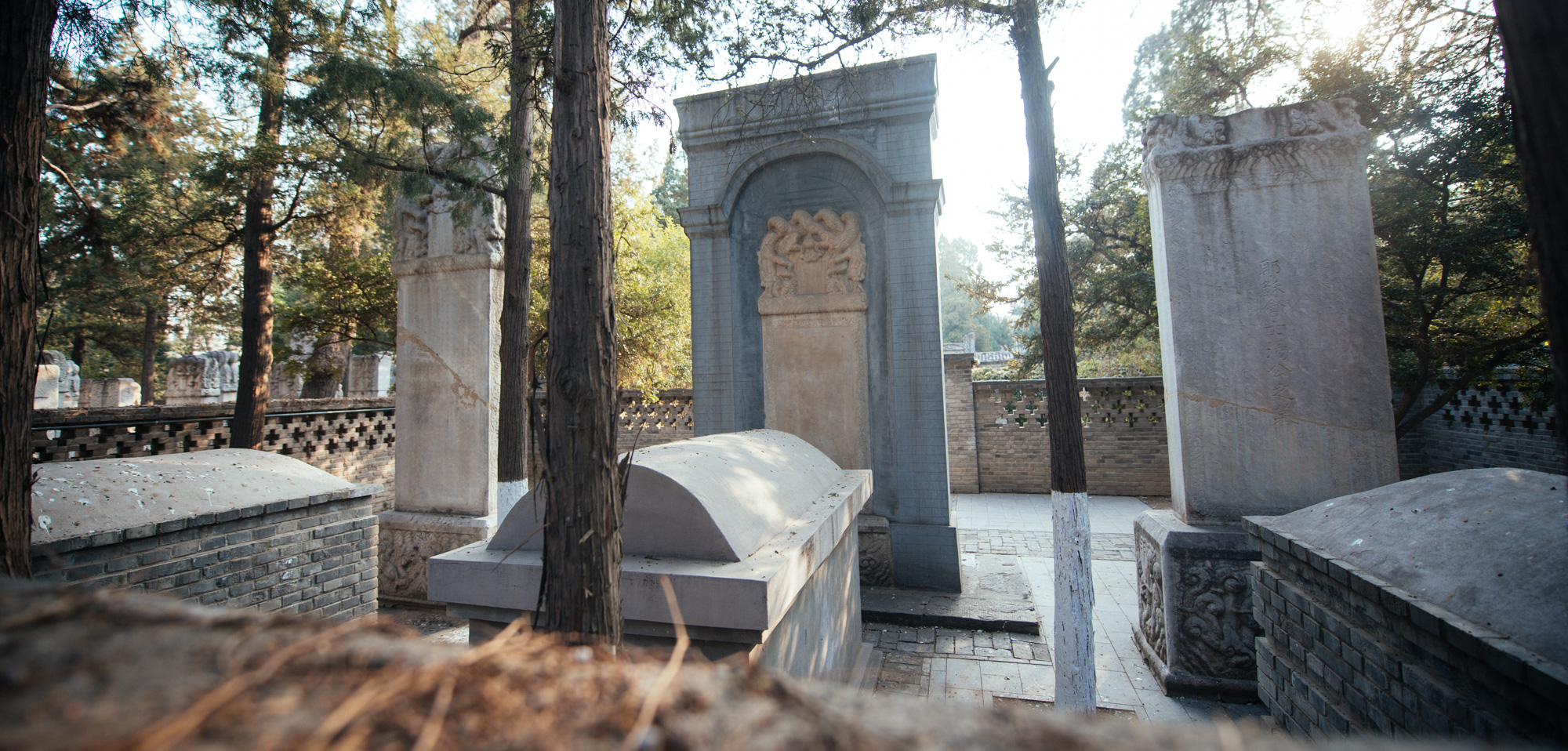 View from behind, with the stone tombs visible.