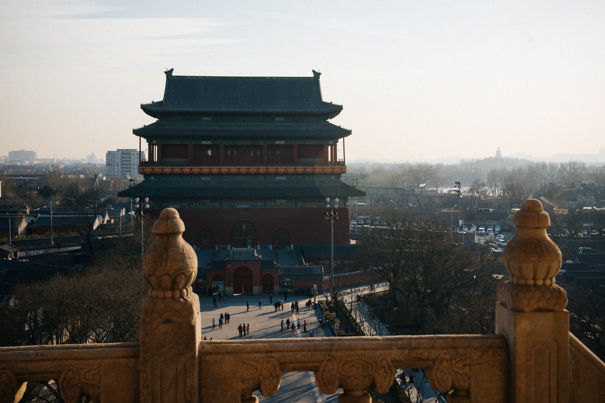 View of the Drum Tower from the top of the Bell Tower. In the back, to the right, you can see part of the frozen Houhai lake.
