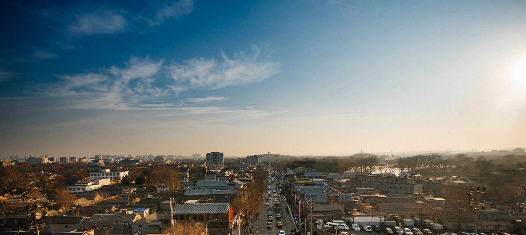 View of Beijing to the south, from the top of the Drum Tower. In the center, far away, is Jinshan park, which stands exactly in front of the Forbidden City (technically oHbehind, but not from this point of view).