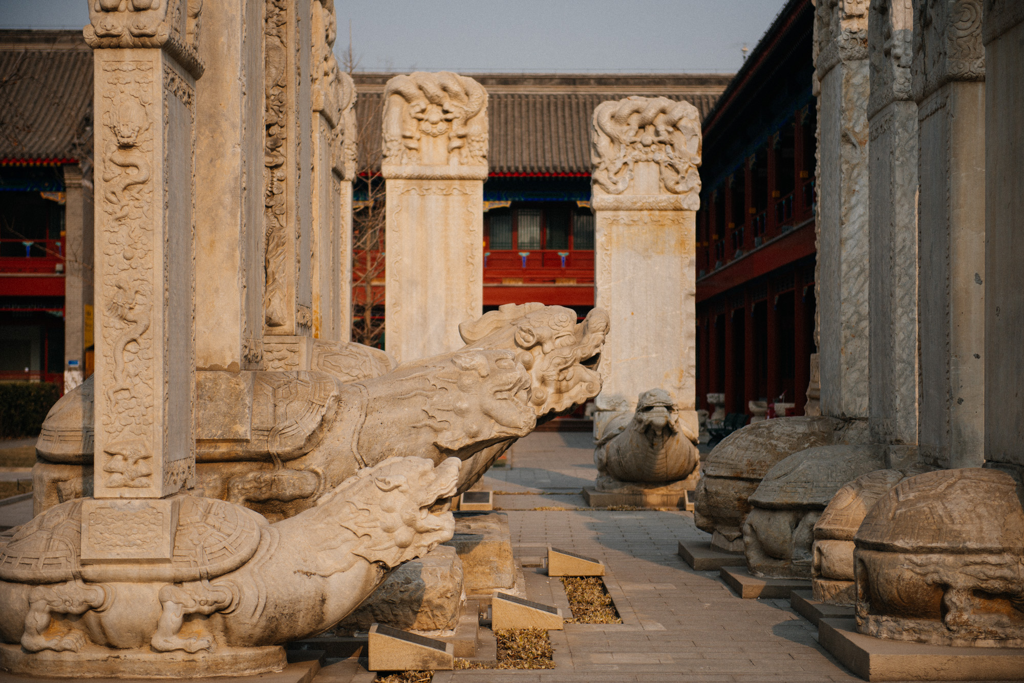 A common sculpture I've seen throughout China is of this turtle carrying a slab on their back. Update: the turtle is not a turtle, it is a 赑屃 (bìxì) and is the son of a dragon. (Thanks, Vance!)