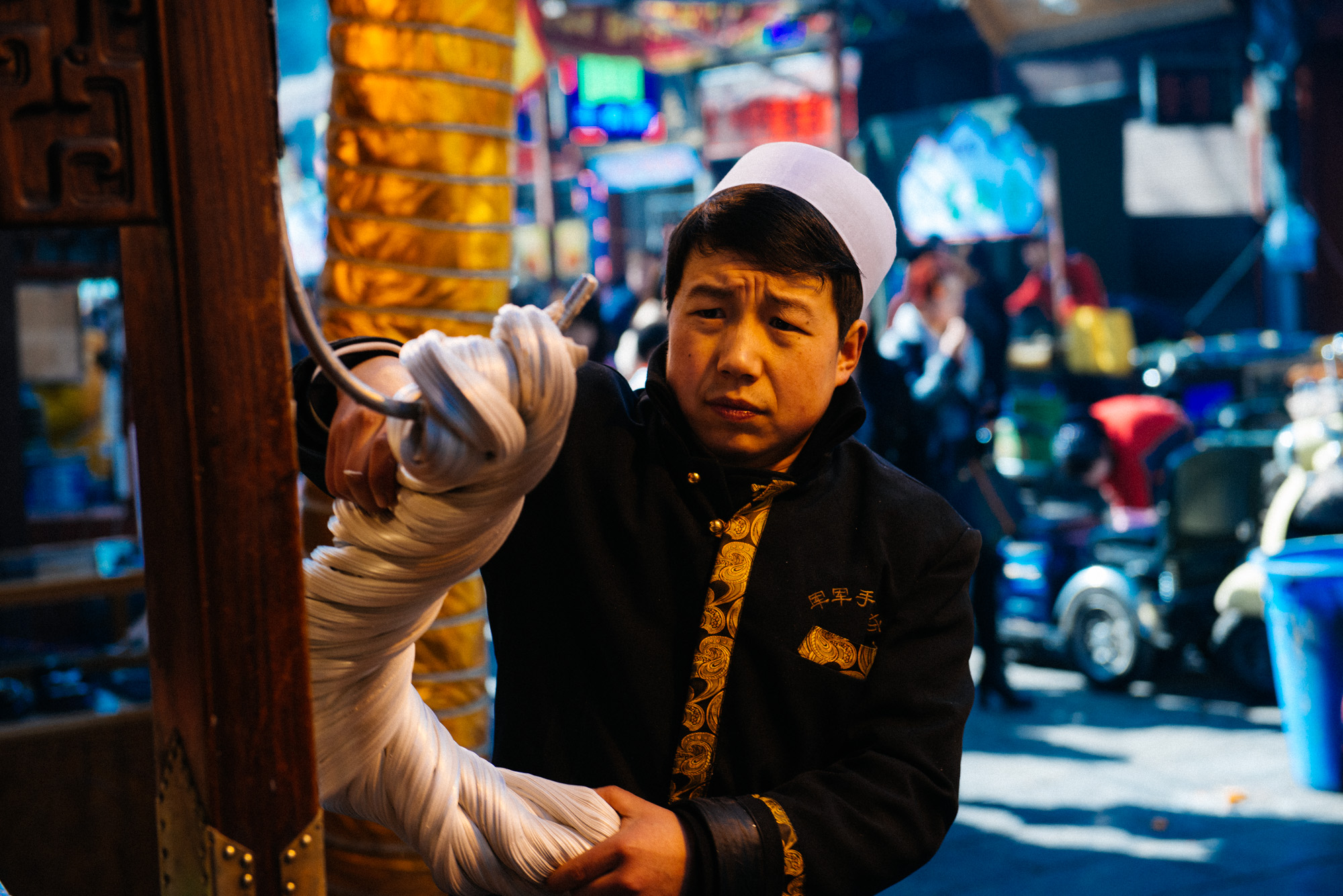 Several stores make candy on the streets where candy makers pull the sweet hanging from a hook making a popular attraction for tourists.