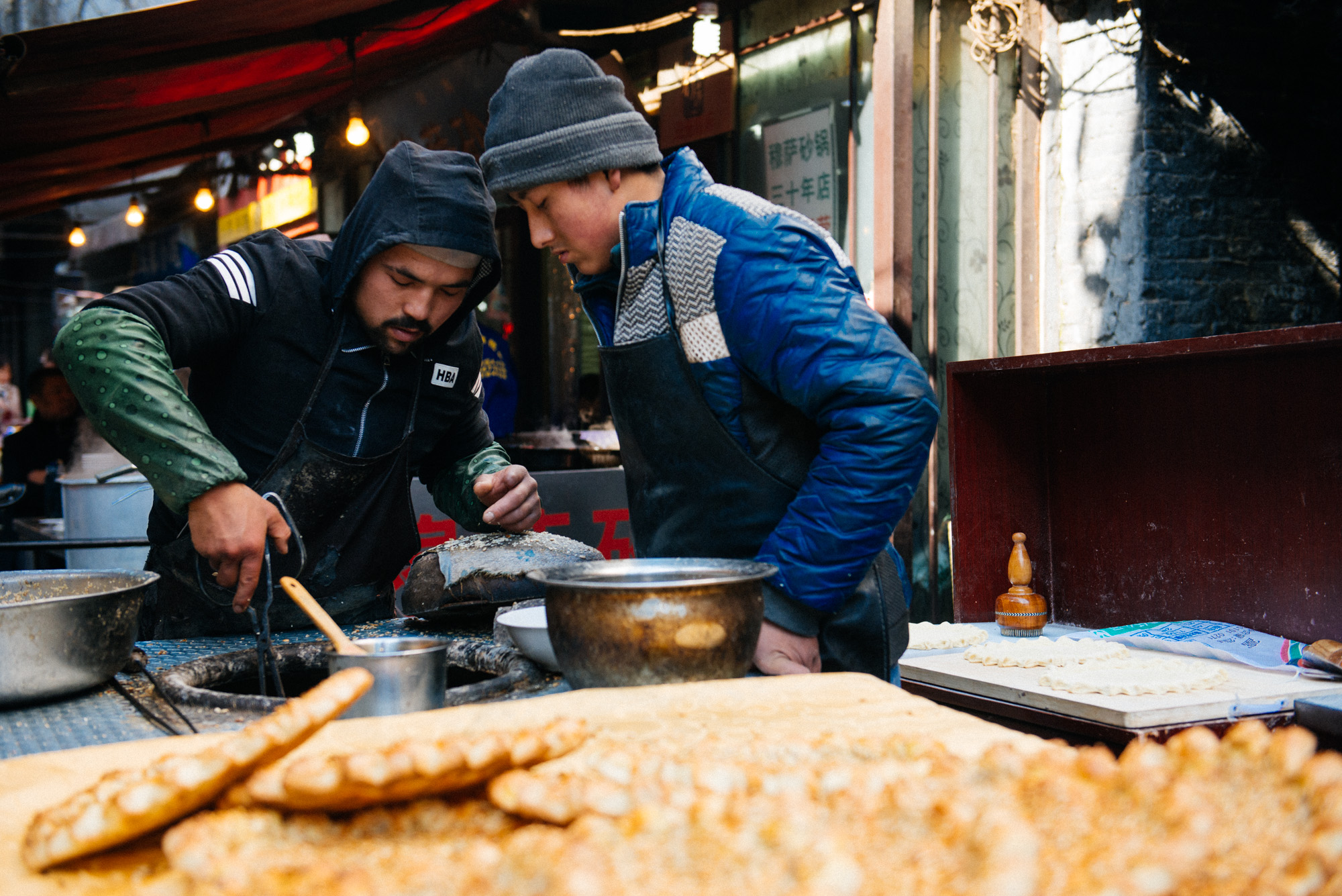 Everywhere you can get this type of bread in the area. Sorry, I didn't catch what it is called. They make it in a spherical oven. They beat the dough and then stick it inside the oven walls. When it's done they pull it out with those huge tweezers and sell it.