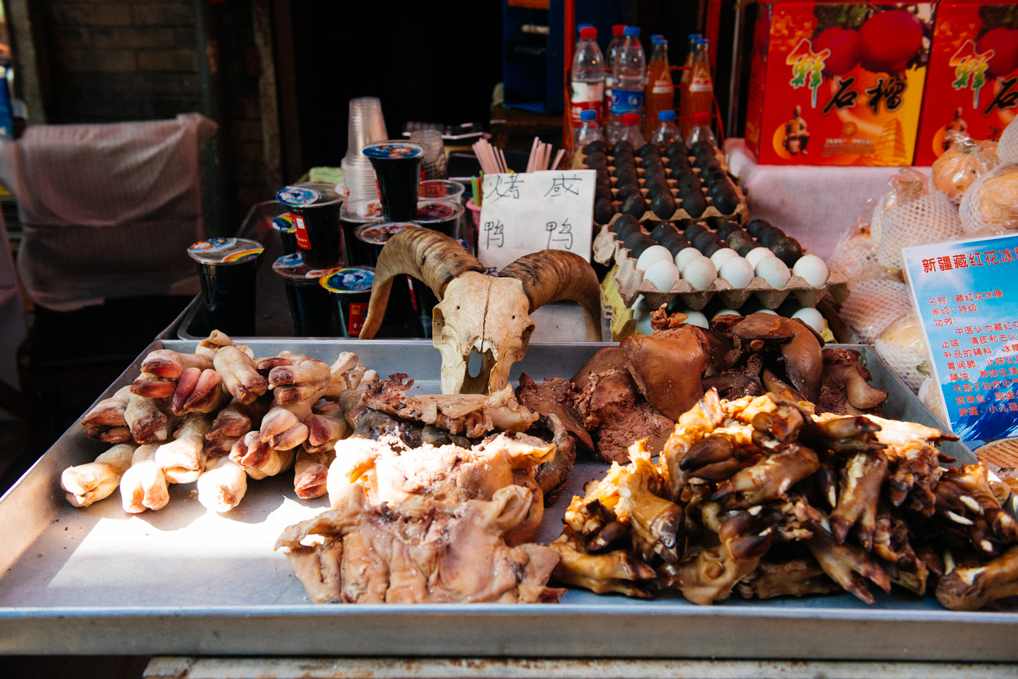Here you have goat feet and knees for sale, considered a delicacy in China. It's quite normal here to eat tendons and the bony bits of an animal. I'm not a big fan of either. I've had a soup-like thing with beef tendon, that is this gooey transparent jelly that tastes like nothing. In China a lot of the taste of the meat comes from the sauce and spices.