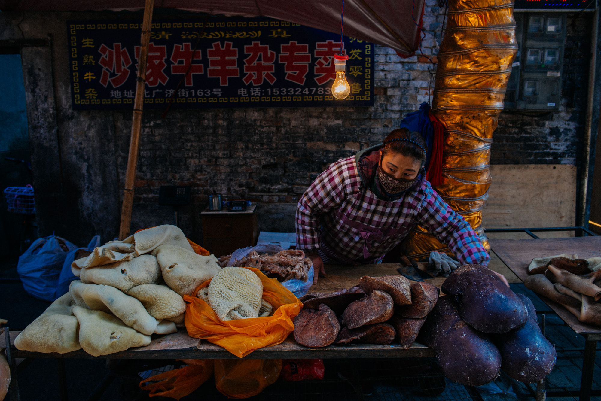 Stomach, intestines, an organ I have not identified and livers are organized for sale. People would just come up, point at what they want, it would be weighed and sold.