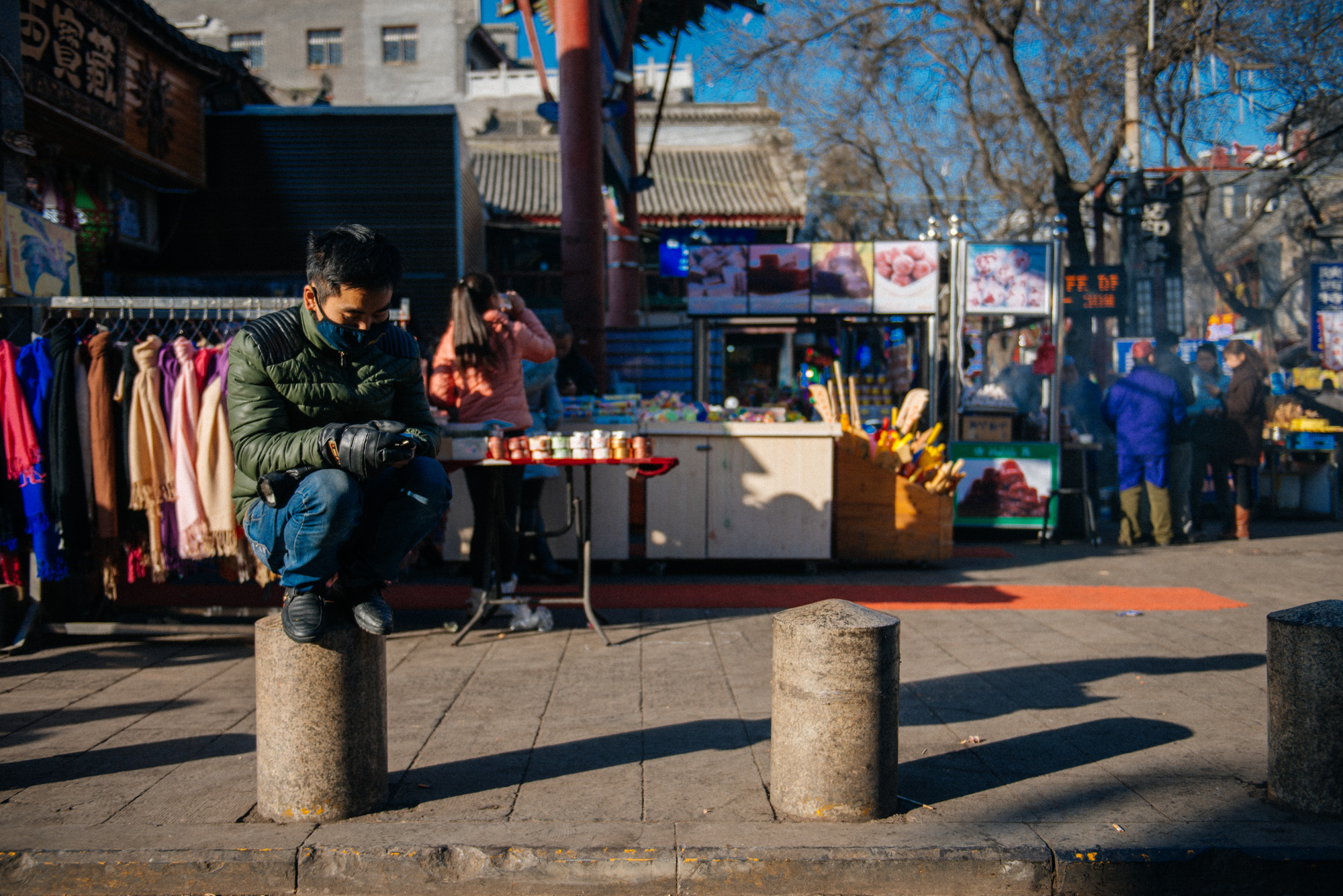 I call this guy birdman. It's a well known fact that in China people like to rest by crouching. Why this man decided to crouch on top of a post, I don't know. Doesn't seem comfortable to me.