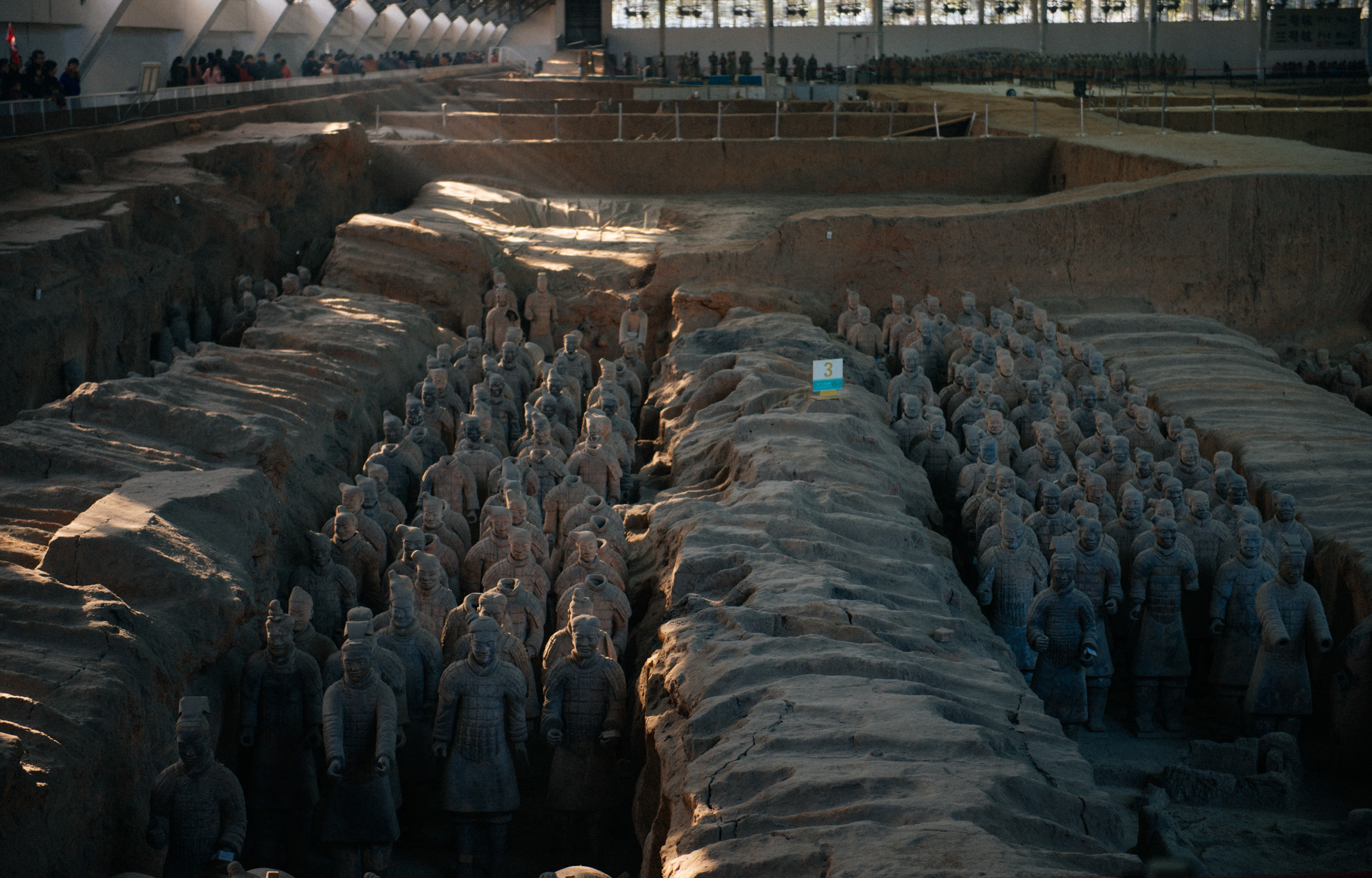 In the front, the soldiers in the pits and right behind them is that section where the restoration takes place. The tourists walk around and see everything from above.