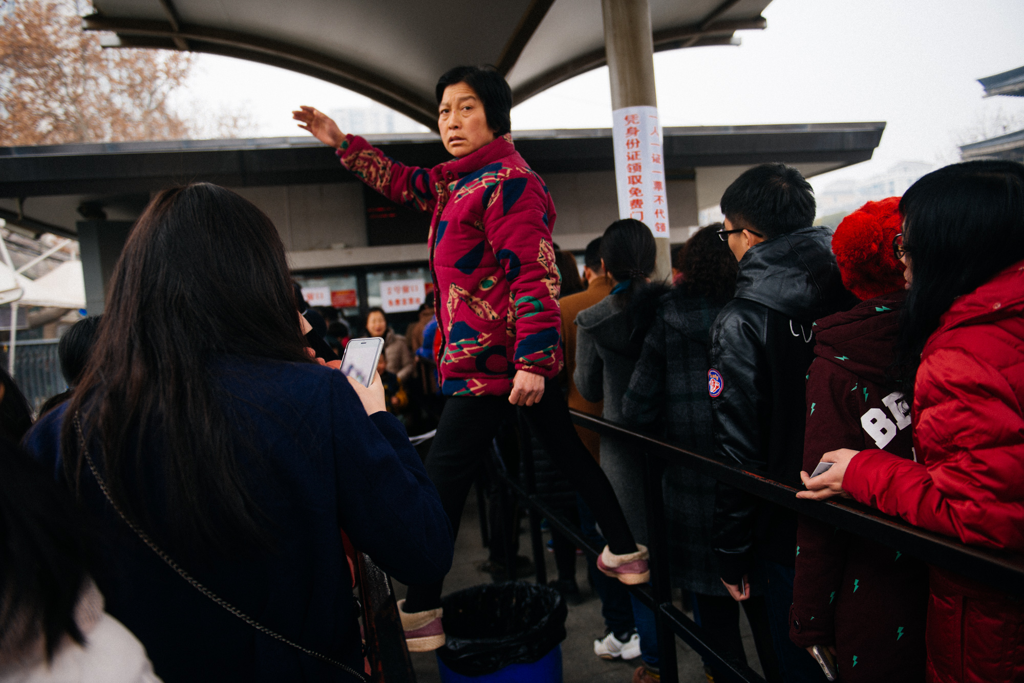 Cutting line was endemic. So many people just not caring and walking in front of others. This lady got higher to call her friends that stayed behind.