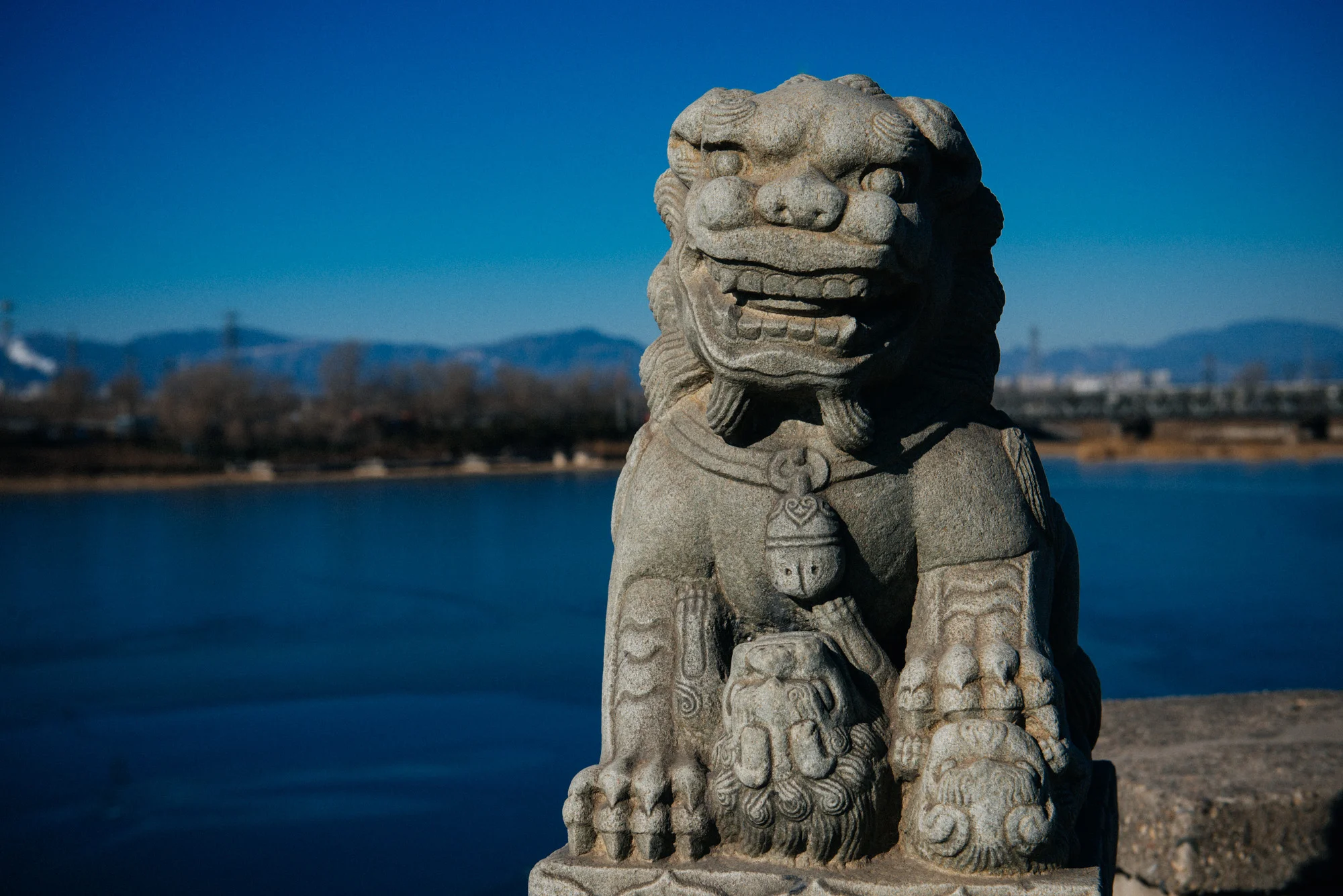 Newer statue of a female lion with its cubs.