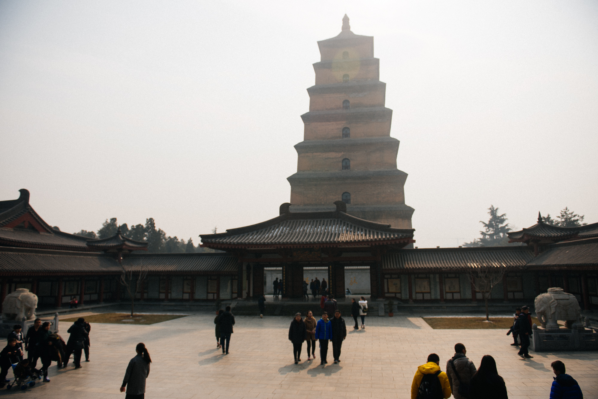 You can tell in which dynasty a building was made by the roof. The Tang dynasty architecture had those horn-like structures on top.