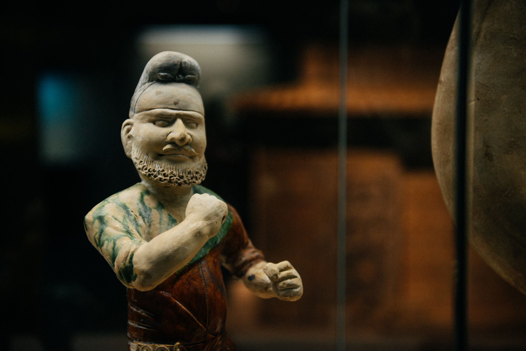 I call this one "come fight with papa smurf". This is a depiction of a foreigner from ancient China. "The non-asian have big noses, small faces and beards", says a friend of mine.