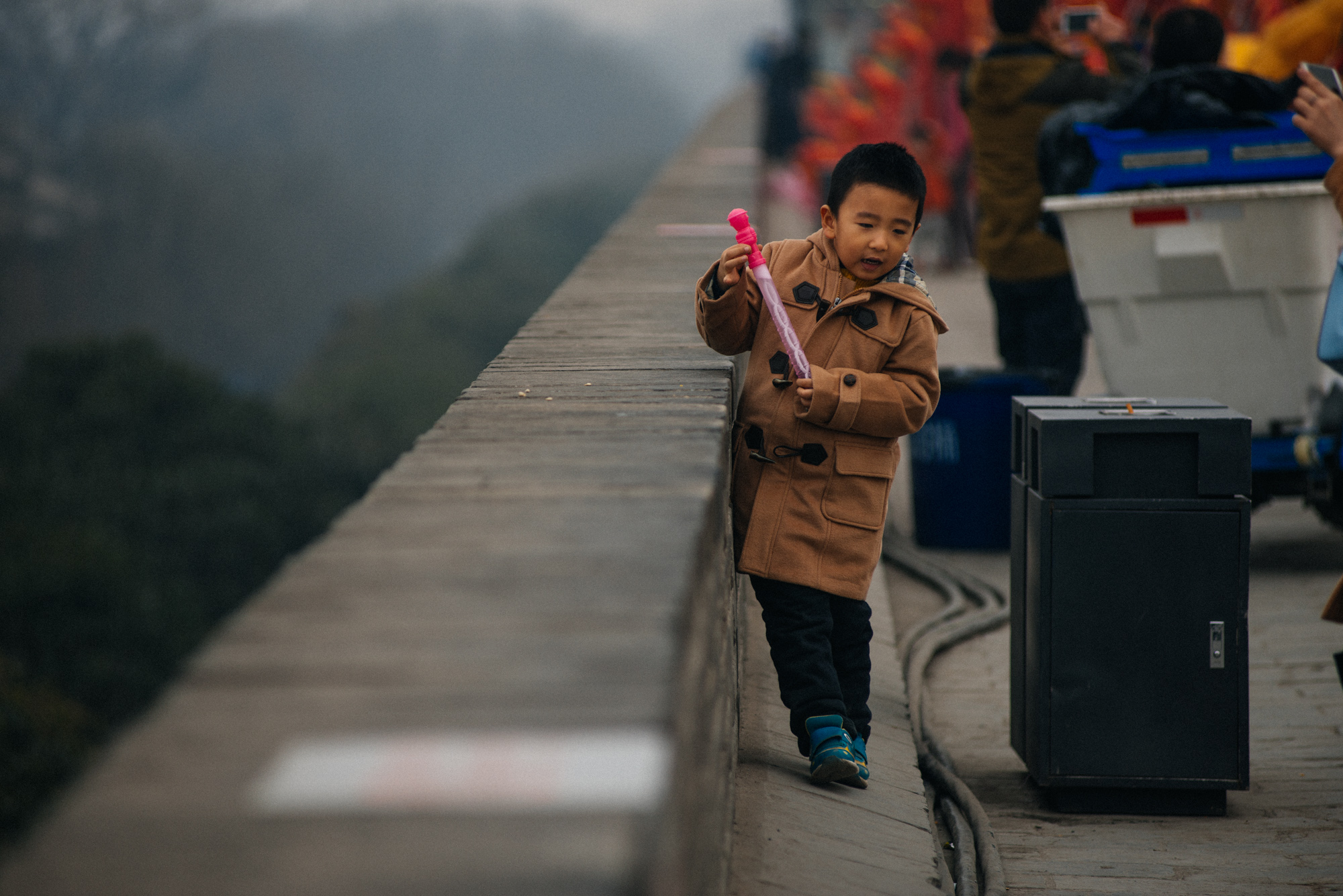 During spring festival, when I went, the top of the wall had dozens of intricate lanterns, divided into groups representing several countries around the world. They would light up at night, forming a beautiful constellation of lights. This kid was blowing soap bubbles and running around through the lanterns.