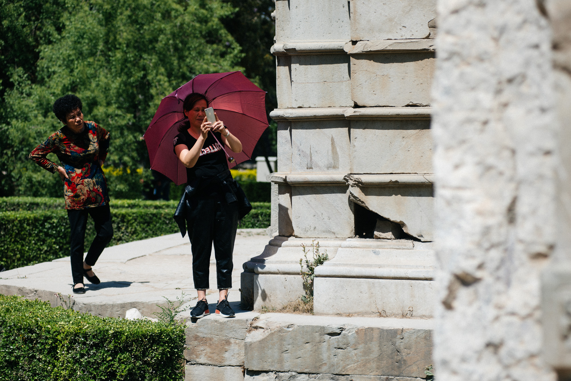 In China, it's very common to see people, specially women, with umbrellas to protect themselves from the sun.