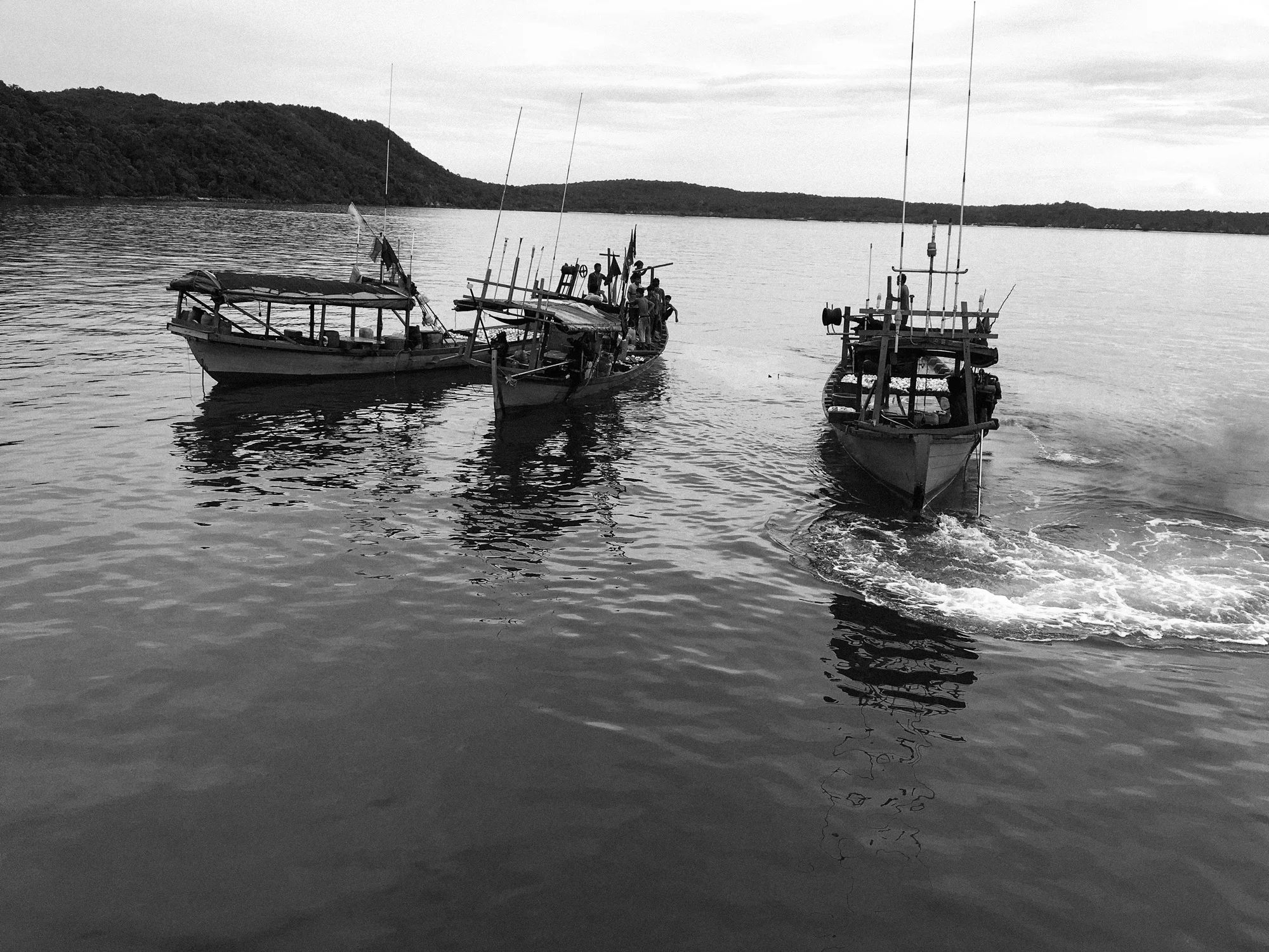 Soon two more fishing boats appear. A lot more talking is done.
