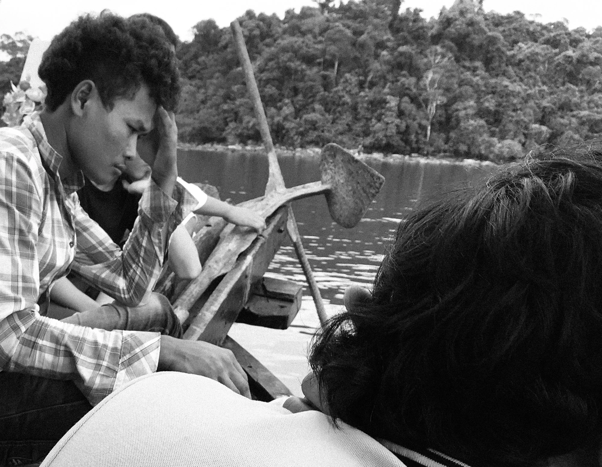 Crewman lowers his head silently as we wait for the speed boat to come.