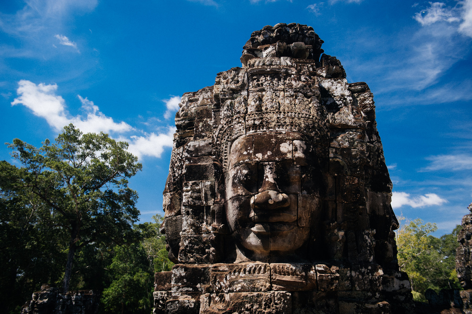 The famous face towers have two, three or four faces. The government of Japan has been helping to restore this site.