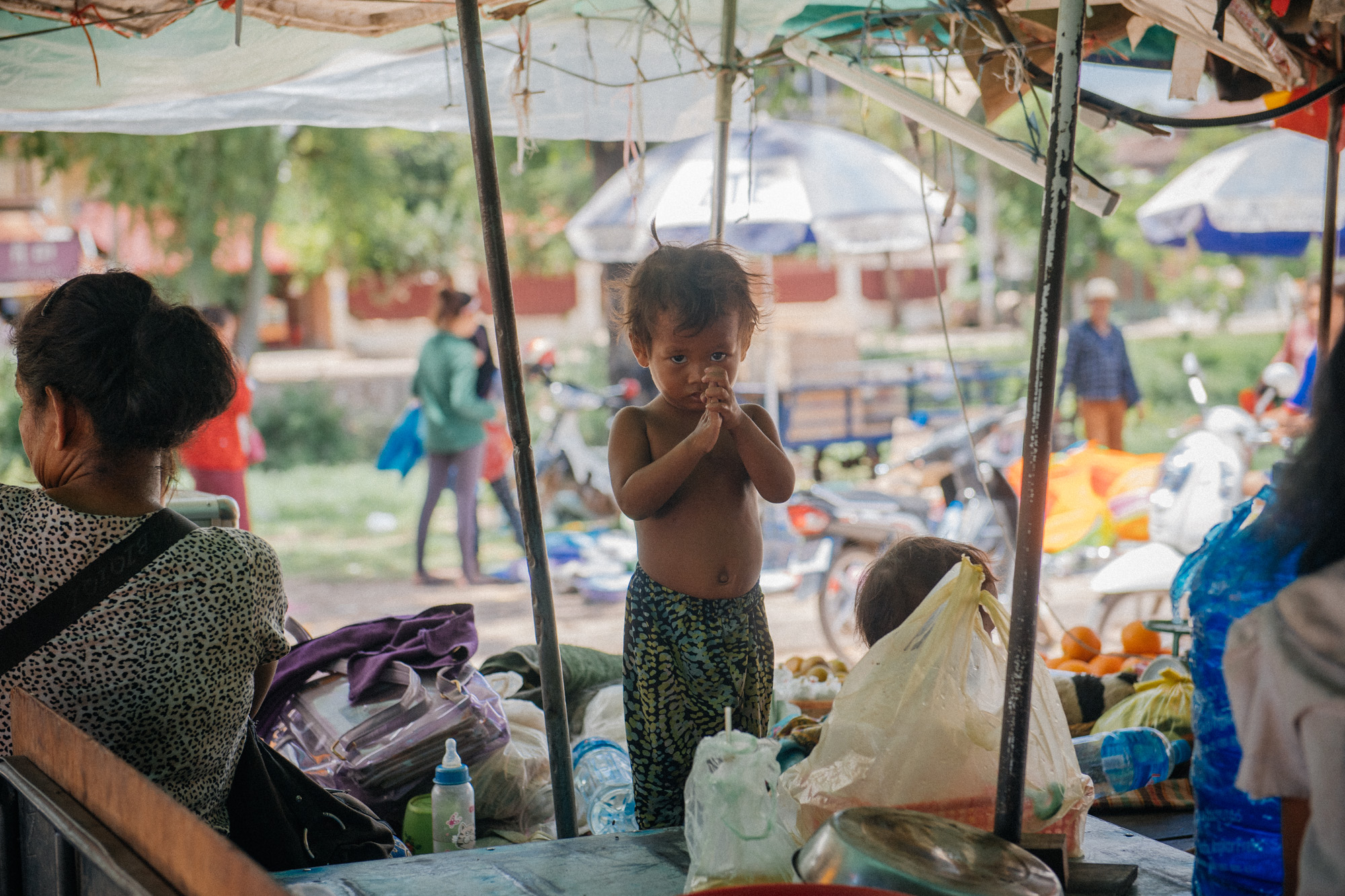 Leaving the market, this little kid put her hands together as a way to say thank you and goodbye.