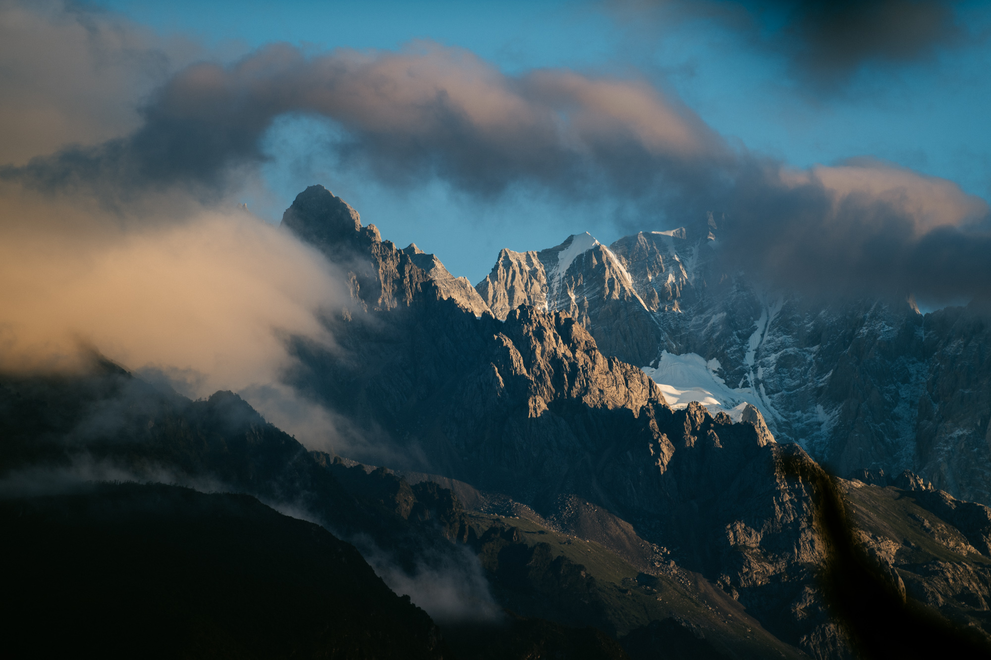 First morning light hits Jade Dragon Snow mountain as seen from the door of my hotel room at around 7 am on a cold autumn morning.