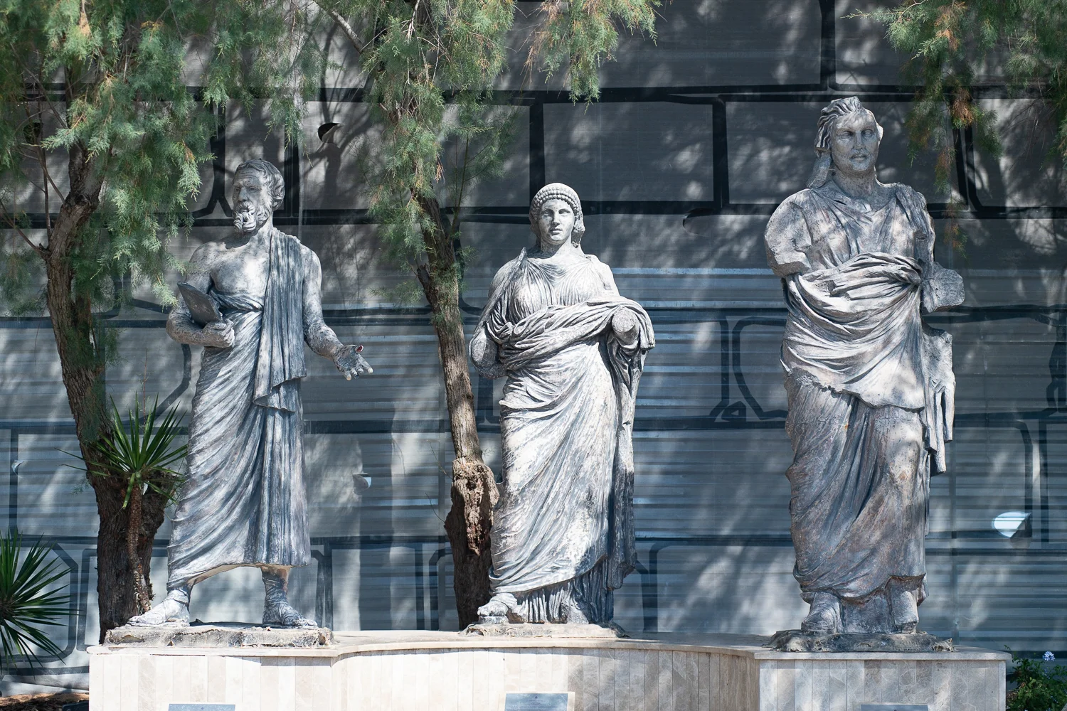 Three cheap fiberglass replicas of statues recovered from the Mausoleum are displayed in the entrance of the Castle of Saint Peter.