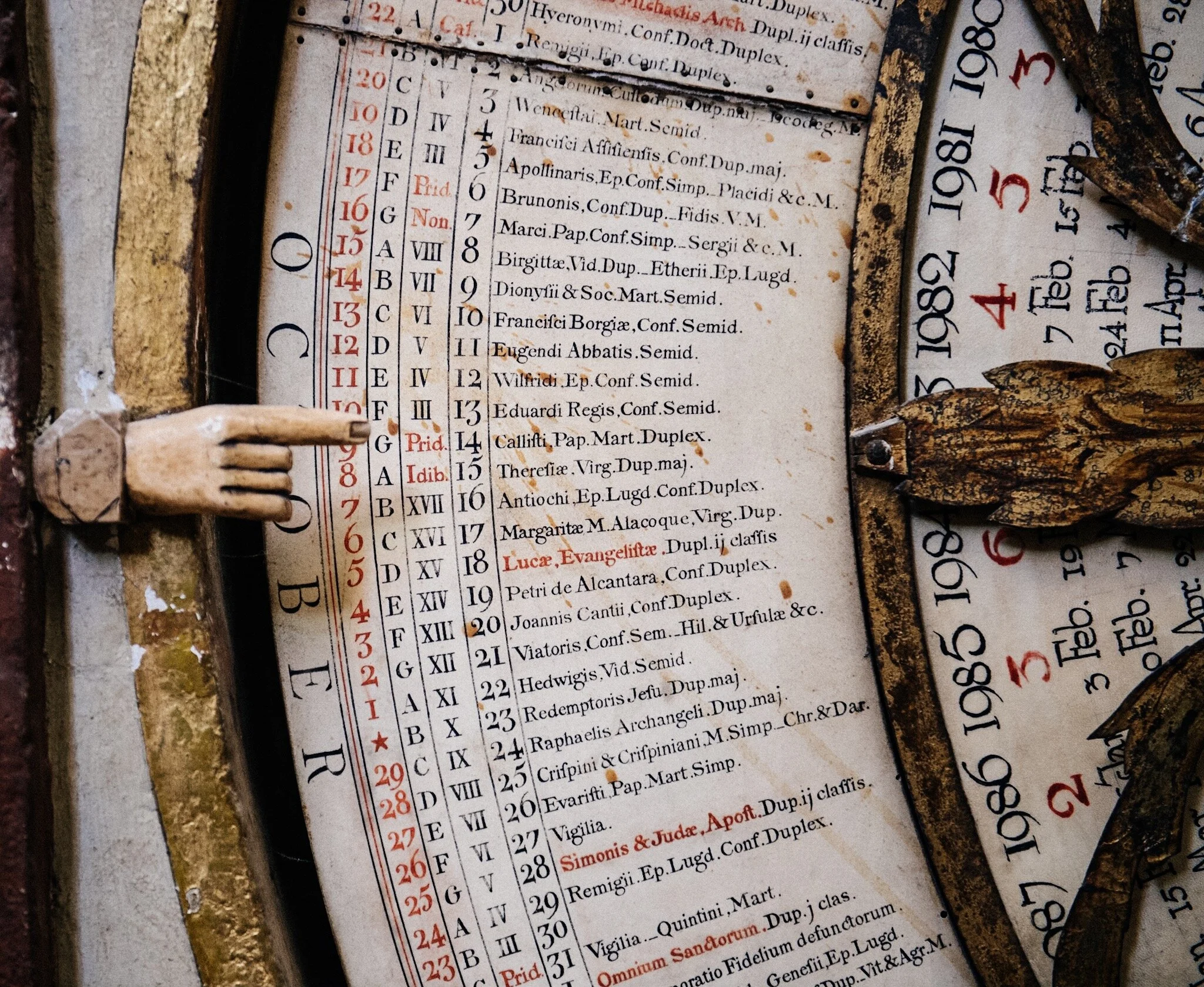 The finger points at the holiday of the day. Check out October 6th, Saint Bruno’s day.