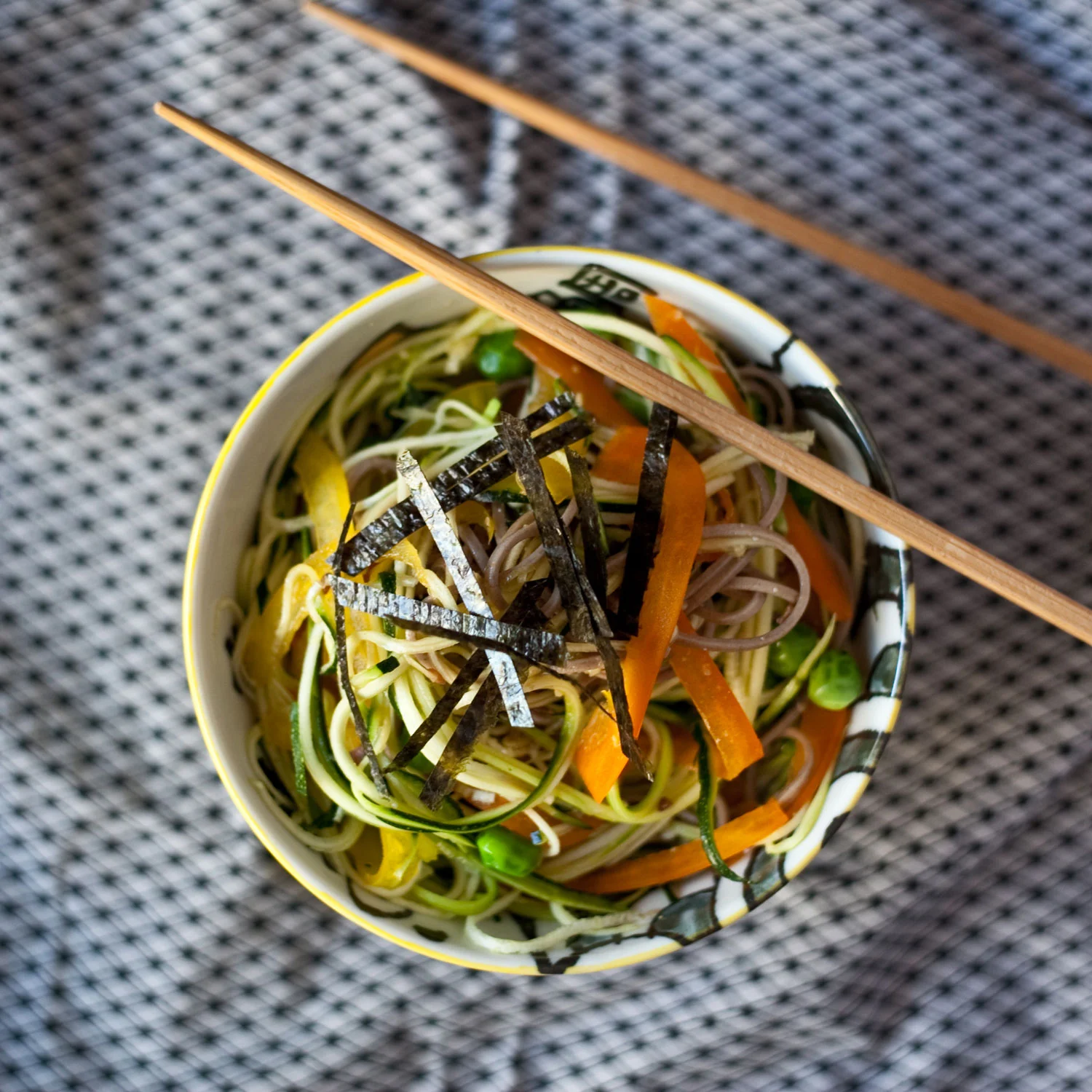 Green tea soba with seasonal vegetables and shredded nori.