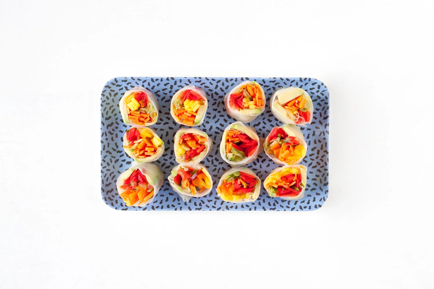 Rice paper wraps filled with raw vegetables.