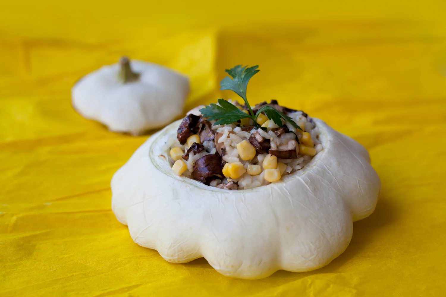 Mushroom and corn risotto served in a scallop shaped patty pan.