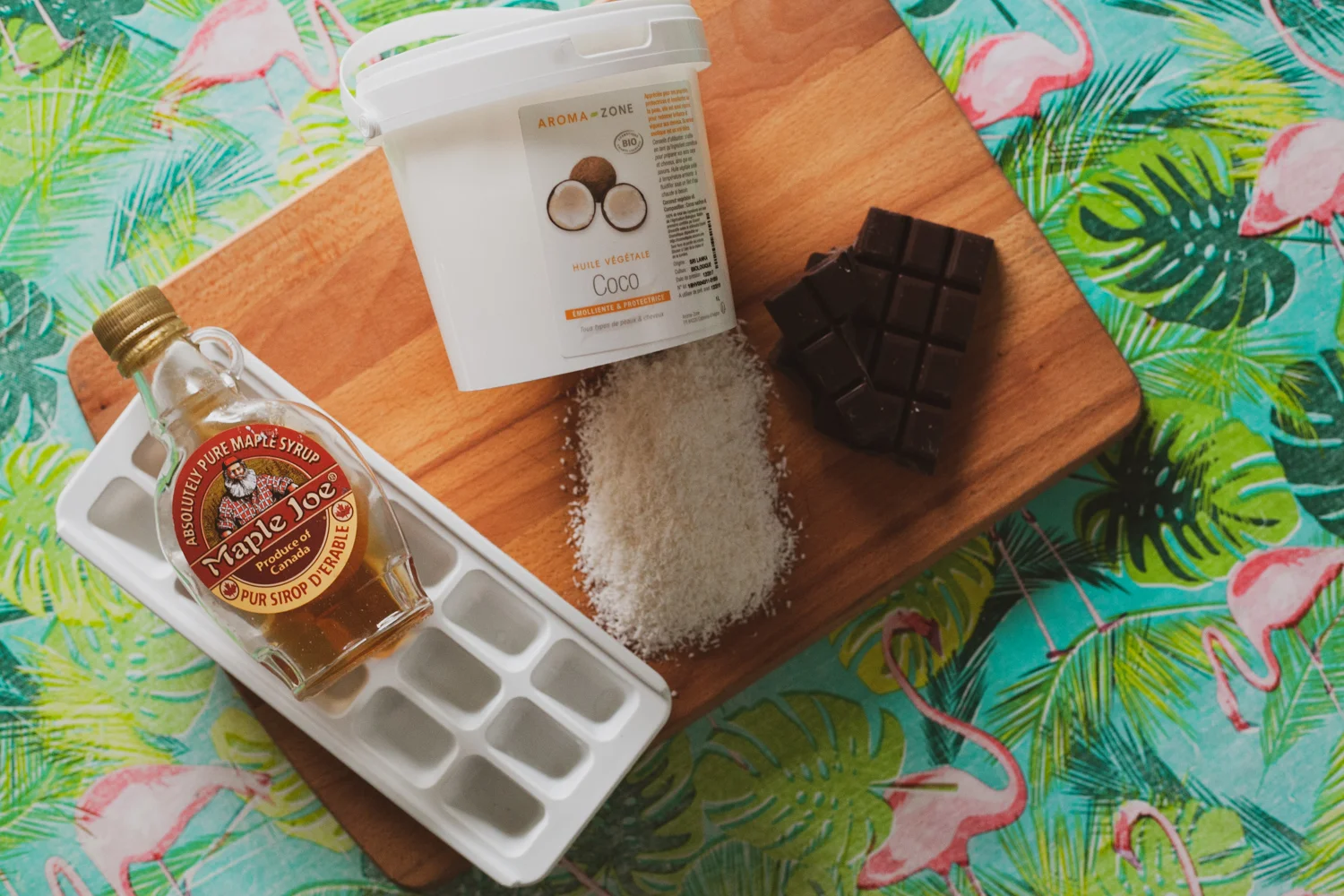 Four ingredients: Shredded coconut, dark chocolate, maple syrup, coconut oil.